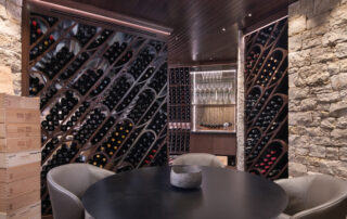 Luxury wine cellar with custom wood racks and climate-controlled storage designed by Kitchens by Kleweno in Kansas City