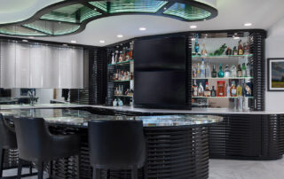 Luxury lower-level entertaining space designed by Kitchens by Kleweno