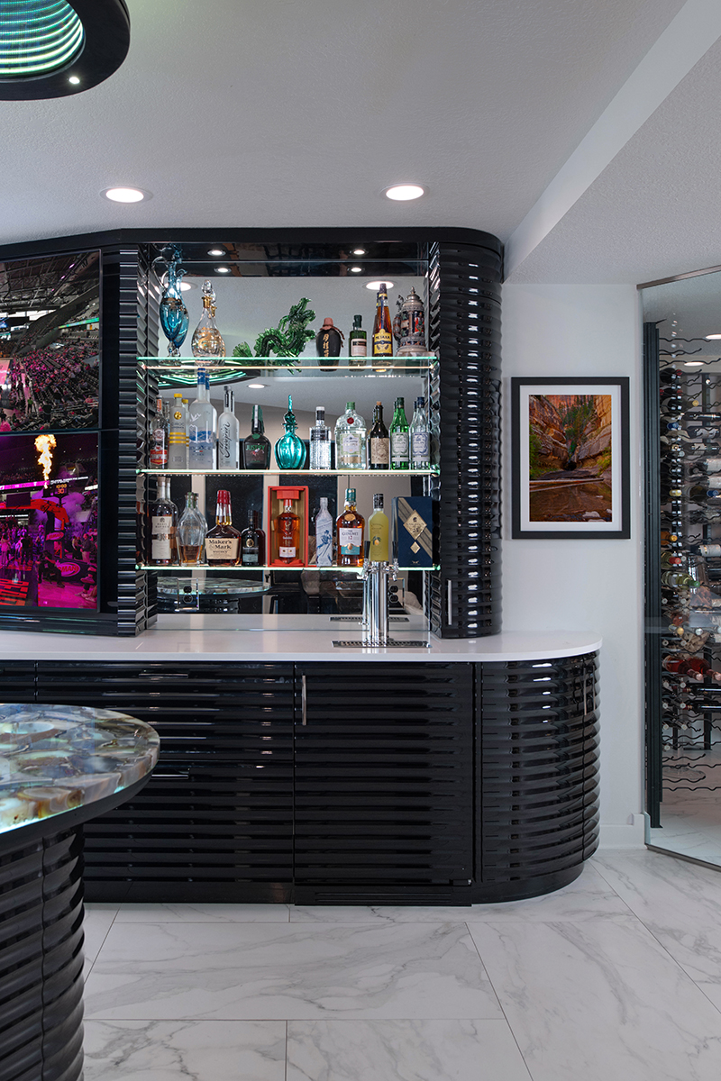 Kleweno custom basement bar and wine cellar Built-in beverage center with custom cabinetry and luxury appliances