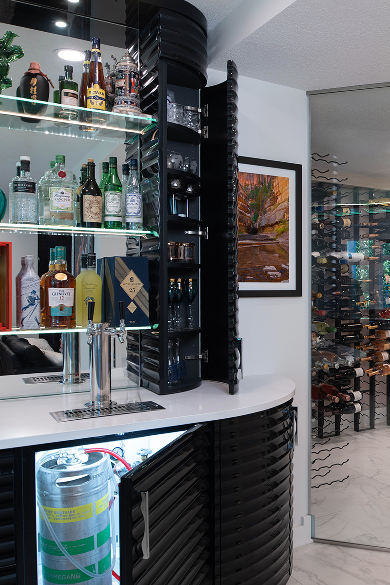 Kleweno custom basement bar and wine cellar Built-in beverage center with custom cabinetry and luxury appliances