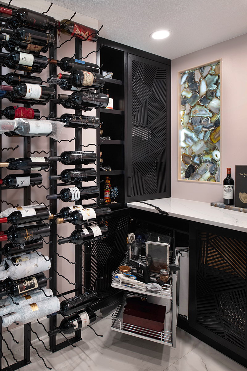 Kleweno custom basement bar and wine cellar Integrated beverage appliances built into custom bar cabinetry