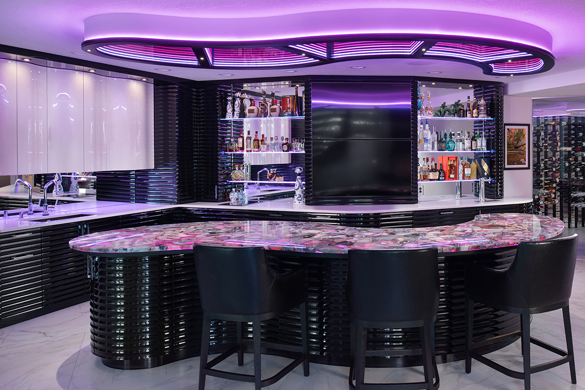 Kleweno custom basement bar and wine cellar Designer lighting highlighting the custom basement bar and entertaining