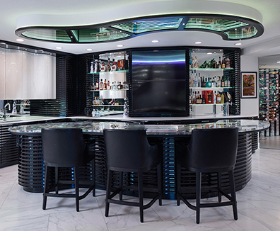 Luxury custom basement bar and wine cellar designed by Kitchens by Kleweno in Kansas City