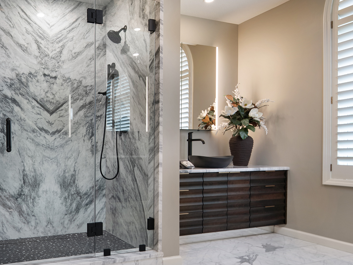 Luxury primary bathroom designed by Kitchens by Kleweno